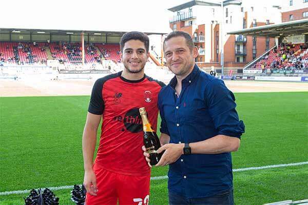 Ruel Sotirou being presented Goal of The Month Award for August by sponsor