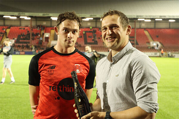 Theo Archibald being presented September Goal of The Month Award for August by sponsor
